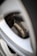 A close-up of a sleek, custom wheel on a polished car surface.