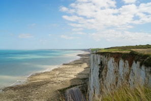 A breathtaking view of a coastal landscape with cliffs and ocean.
