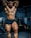 A fitness competitor showcasing their physique after training.