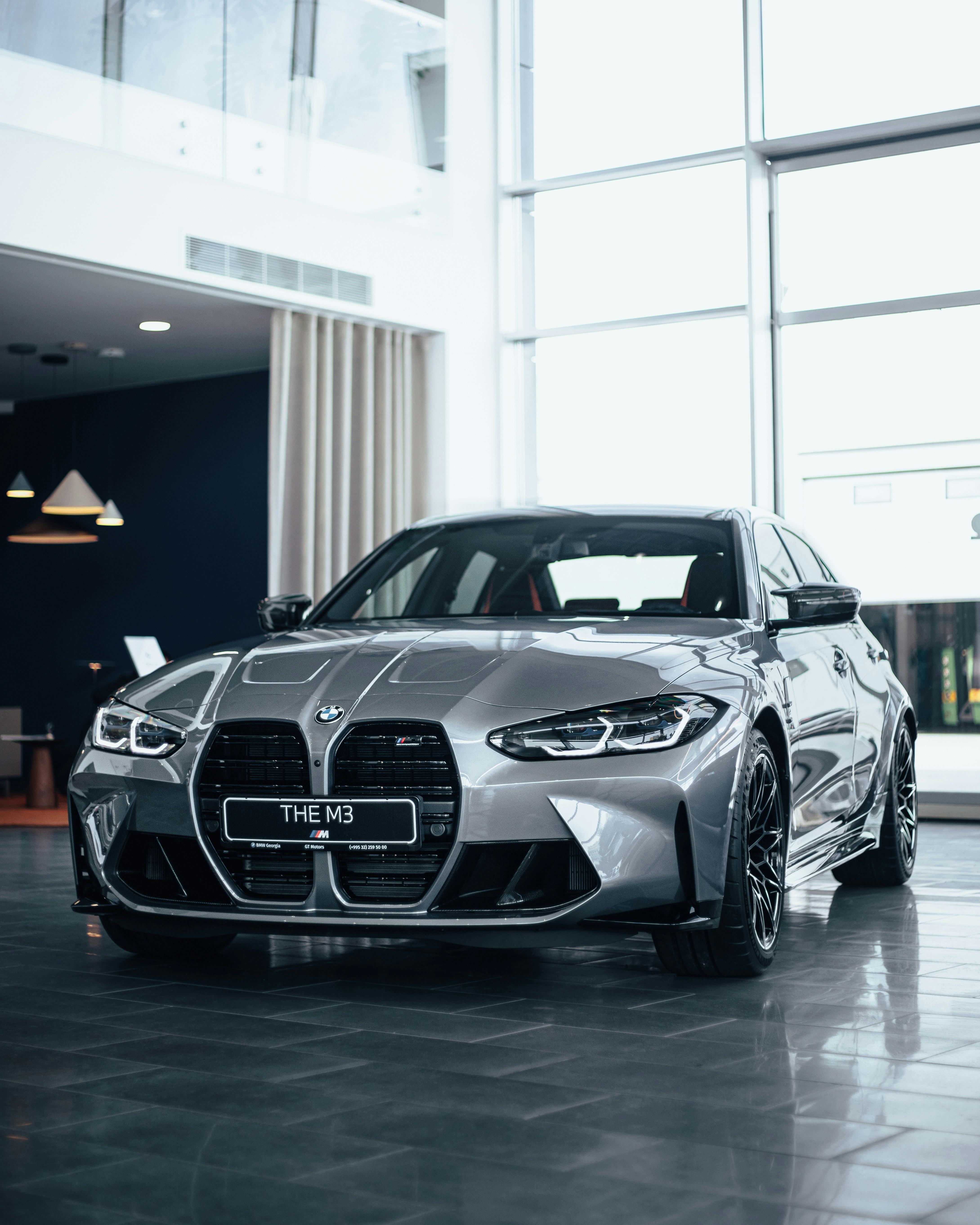 a silver sports car parked in a building