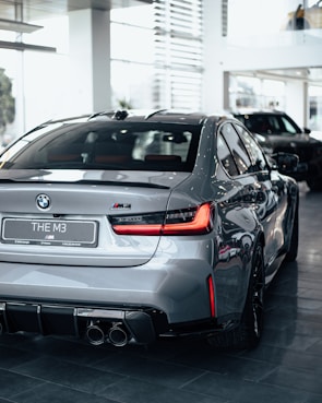 Shiny silver BMW with polished chrome details on display.