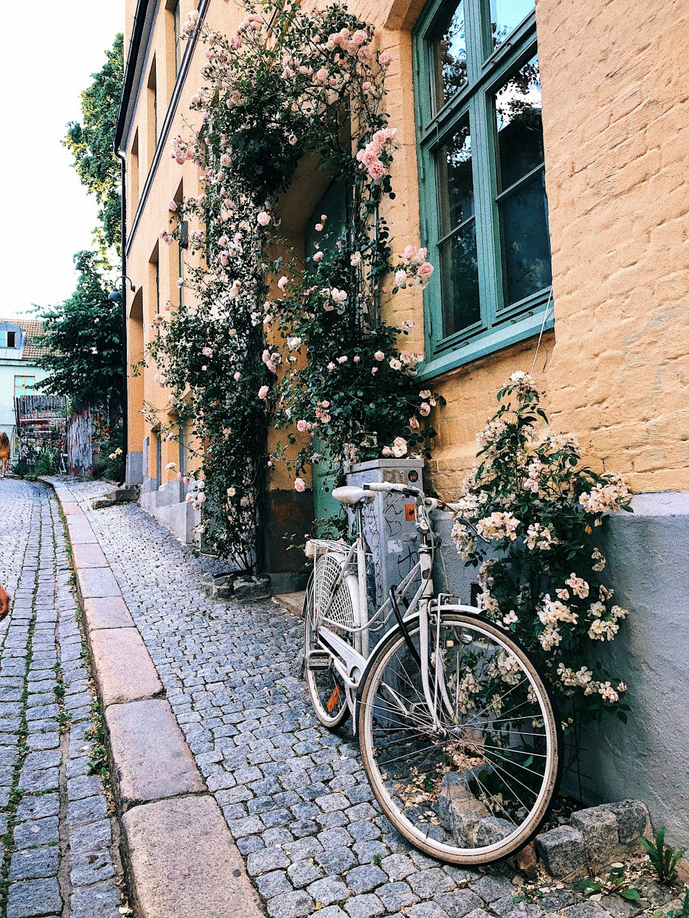 a bicycle parked on the side of a building