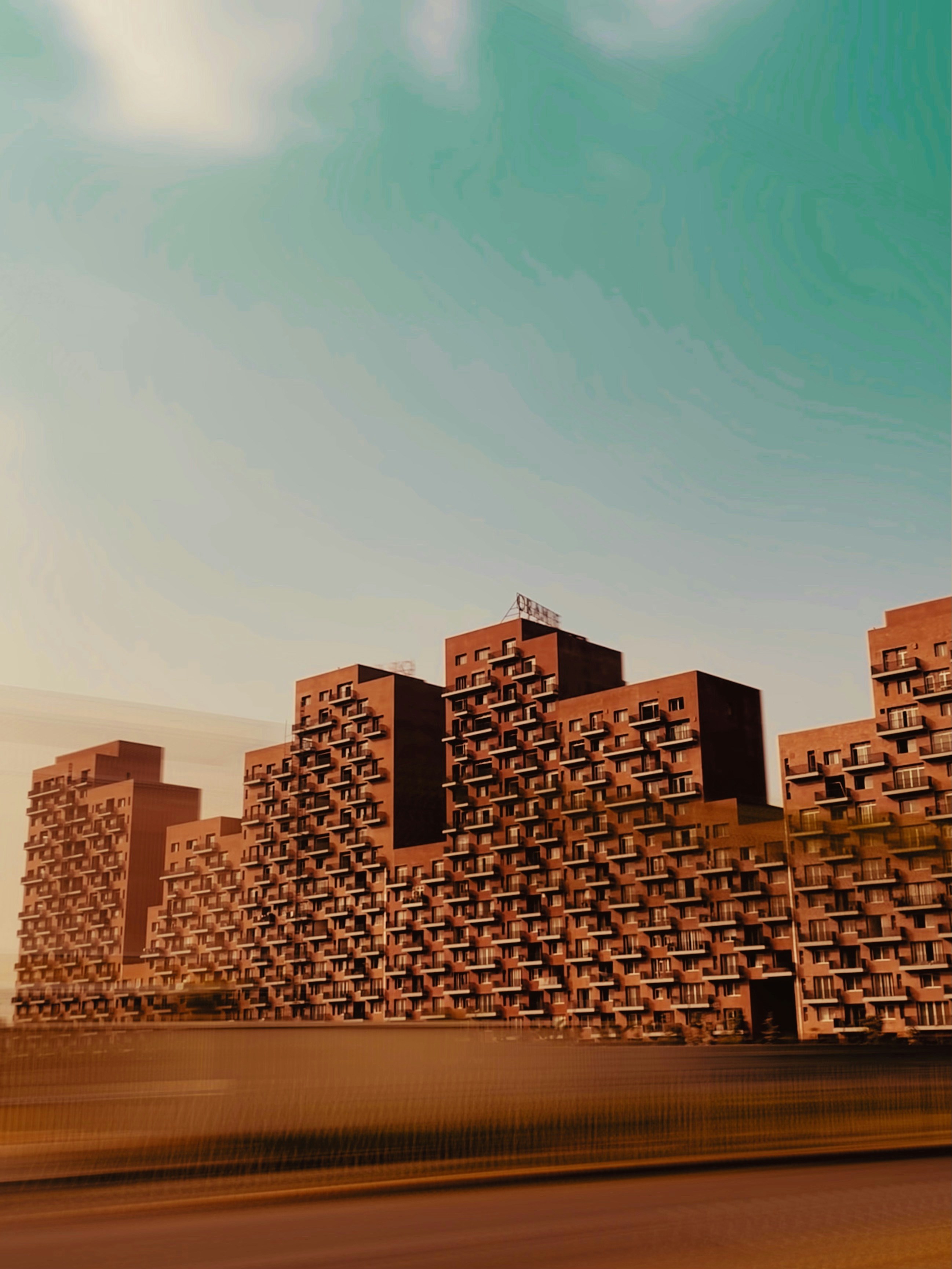 a digital painting of a city with tall buildings