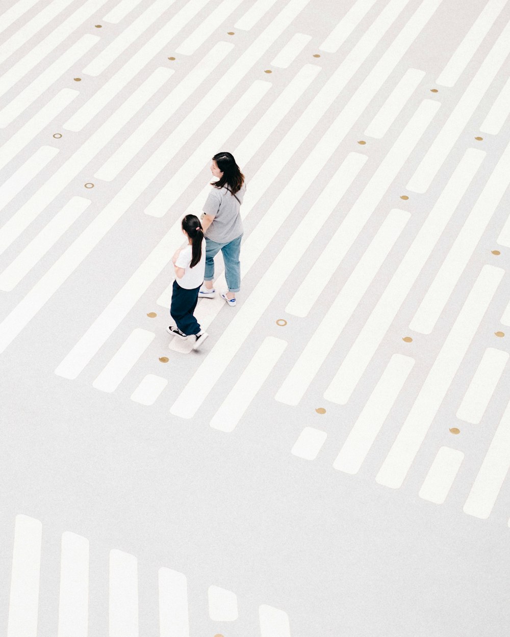 a couple of people that are standing in the street