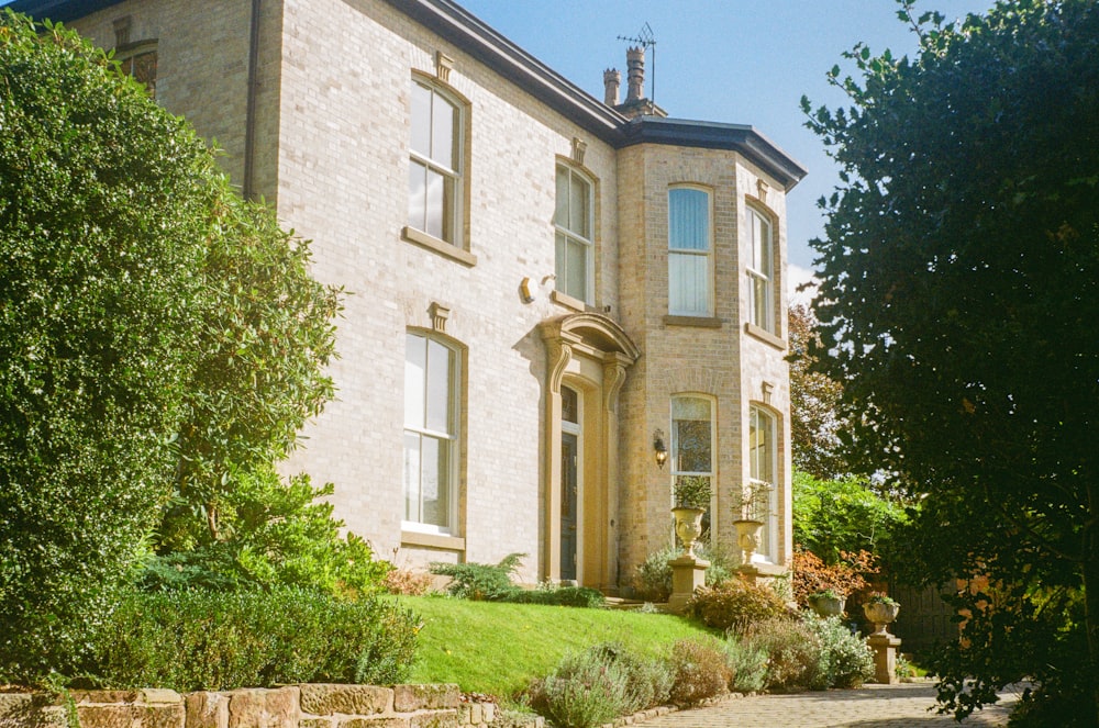 a large house with a clock tower on the top of it