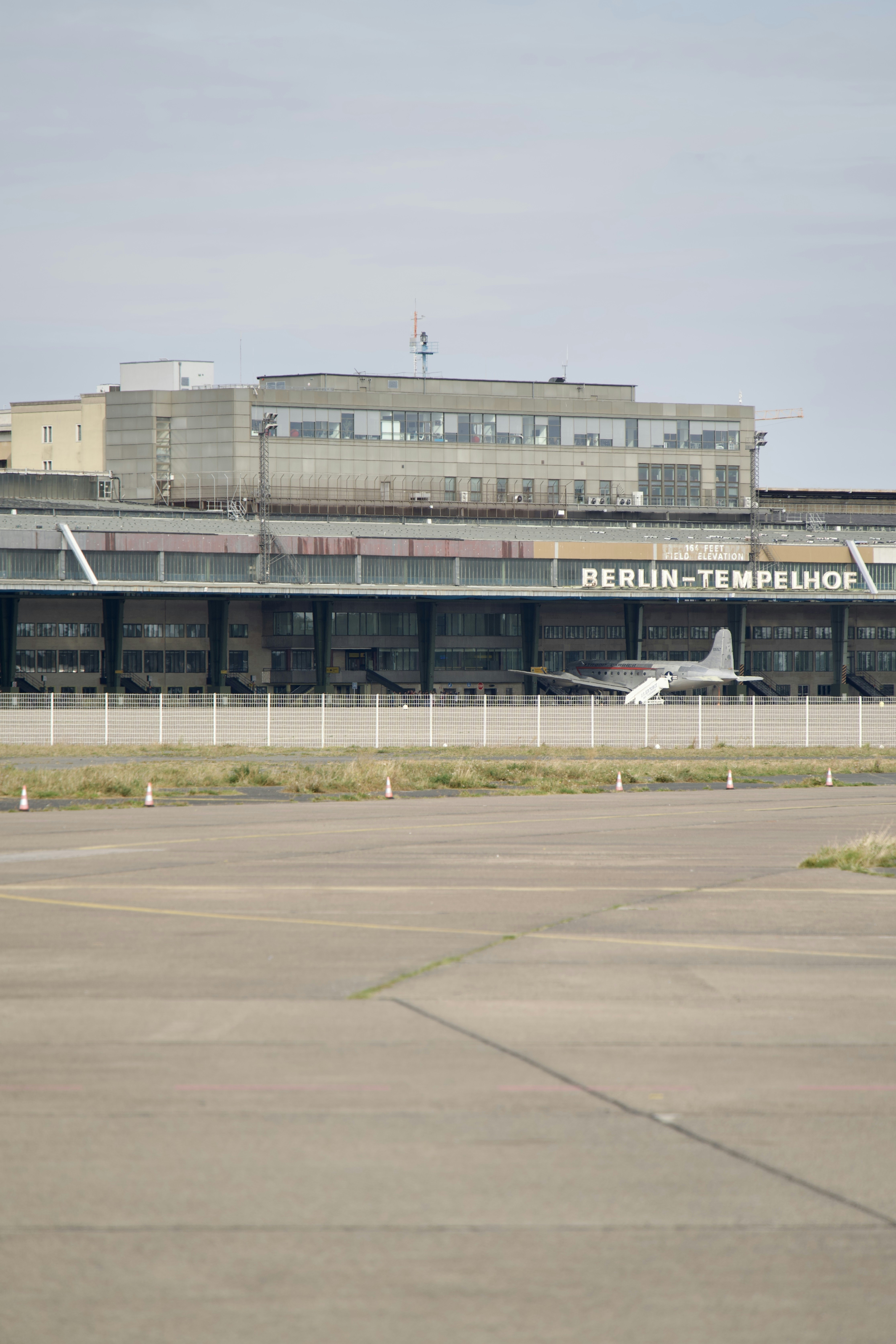 an airport with a plane parked on the tarmac