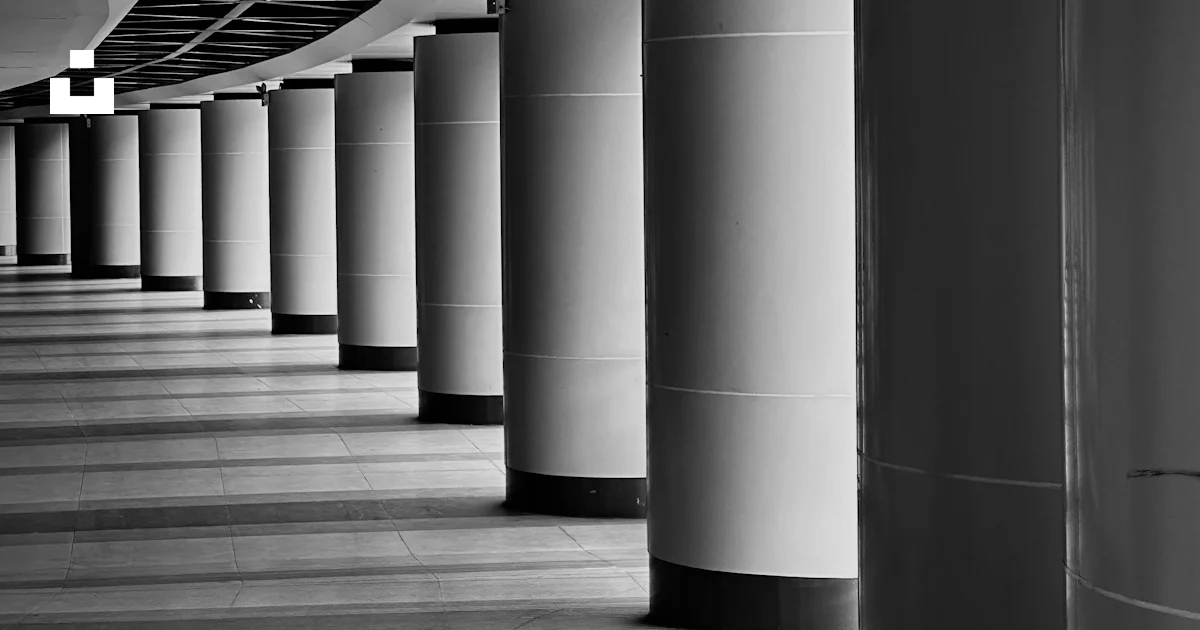 Black and white photograph of a row of columns photo – Free Light and ...