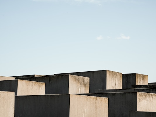 Blocks of geofoam arranged outdoors with a bright blue sky background.