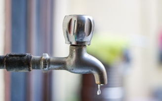 a faucet with water dripping from it