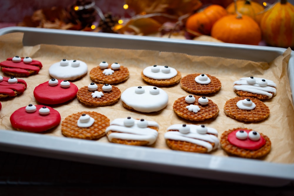 a tray of decorated cookies sitting on top of a table