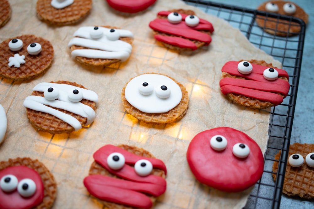 a cookie sheet topped with cookies covered in icing