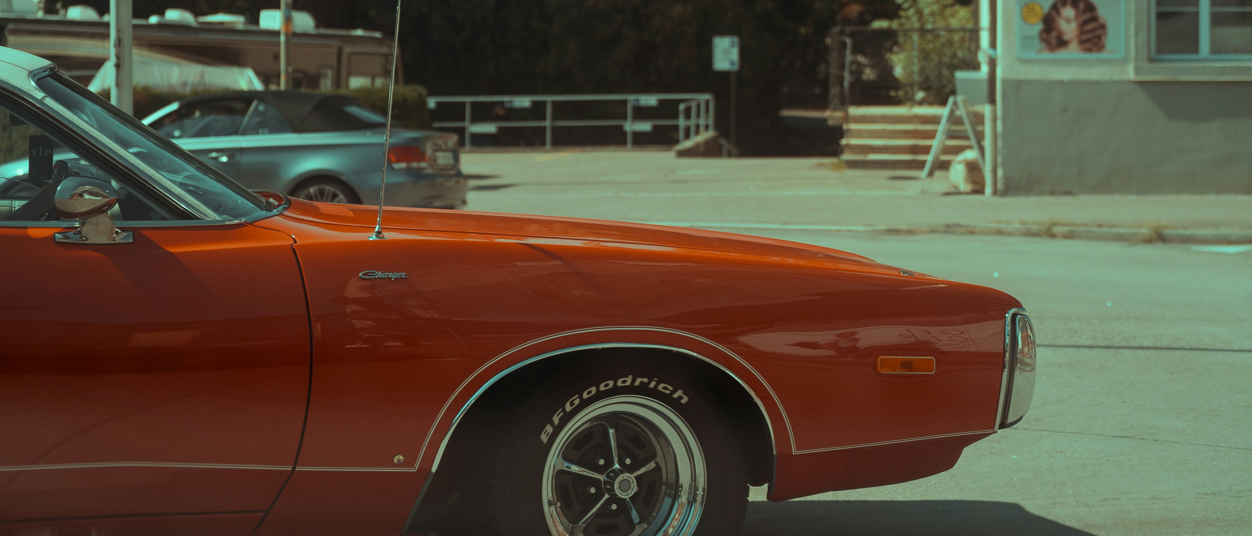 a red car parked on the side of the road