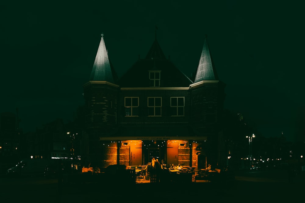 a building lit up at night in the dark