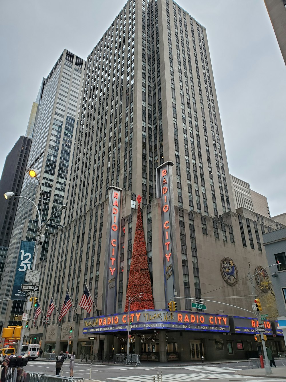 a large building with a christmas tree in front of it