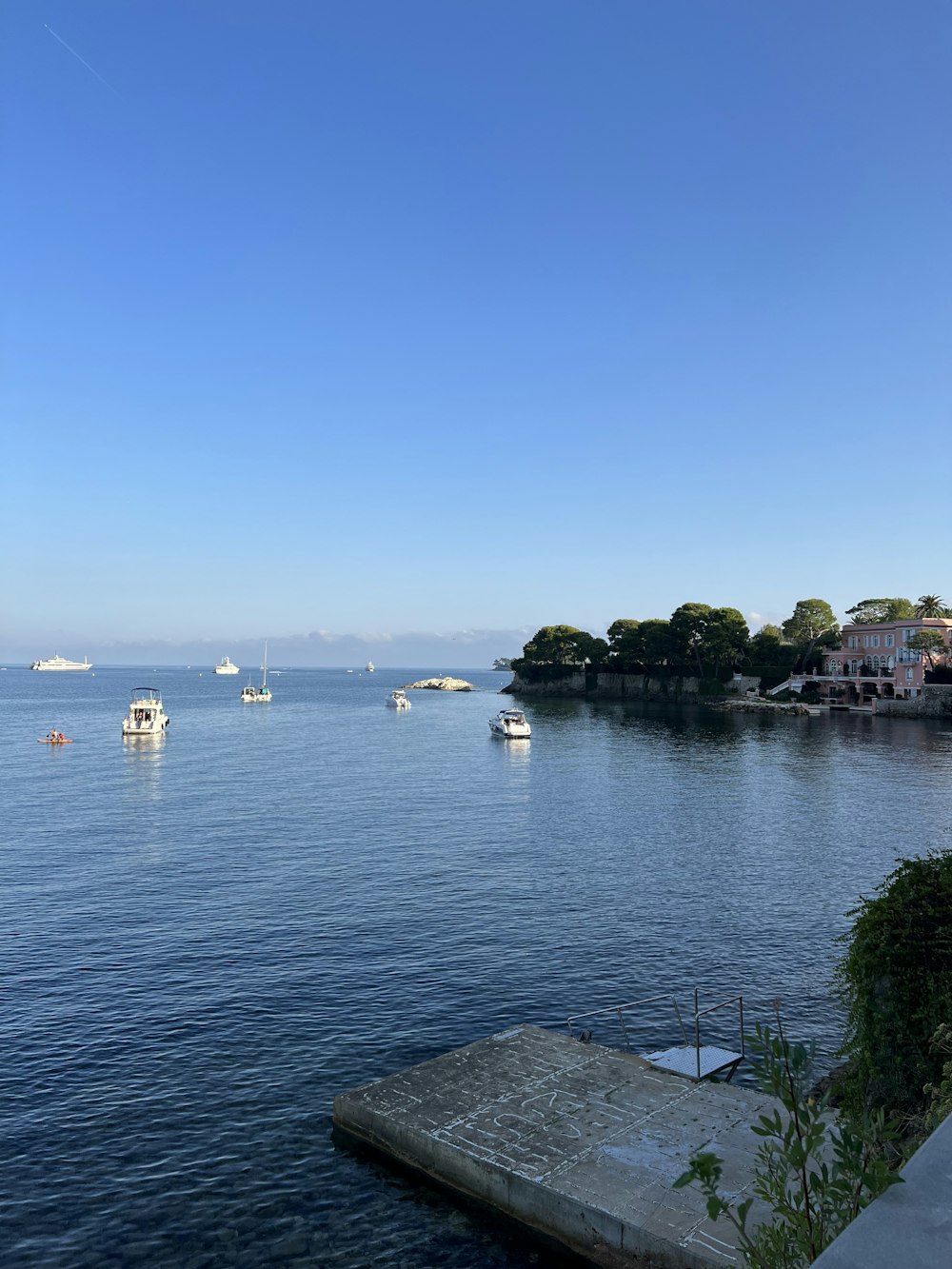 a body of water with boats in the distance