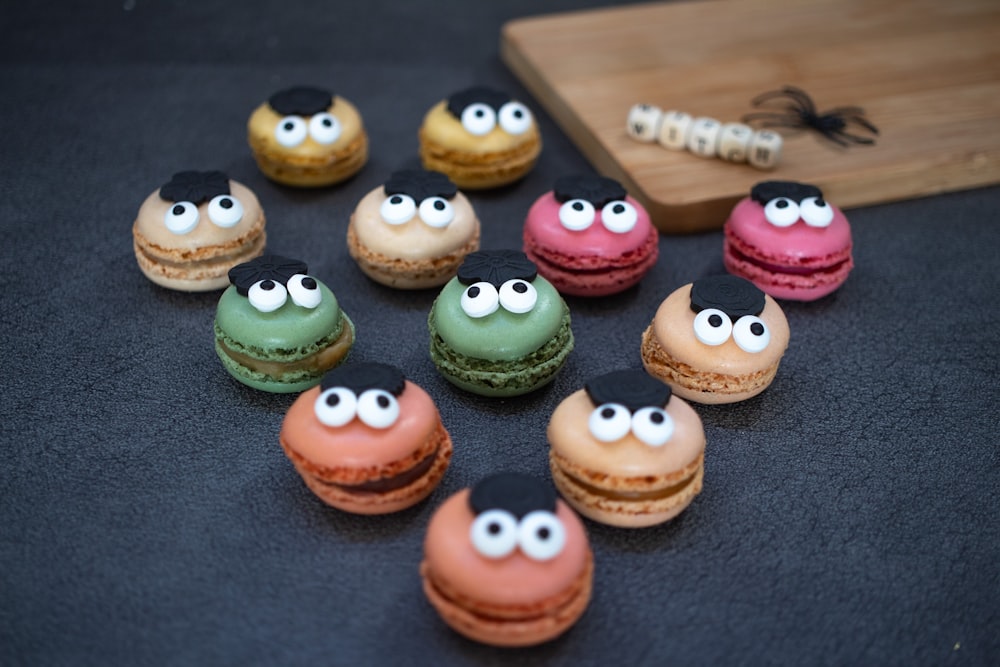 a group of macaroons with googly eyes