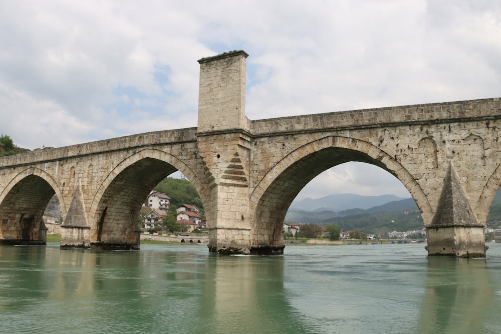 a stone bridge over a body of water