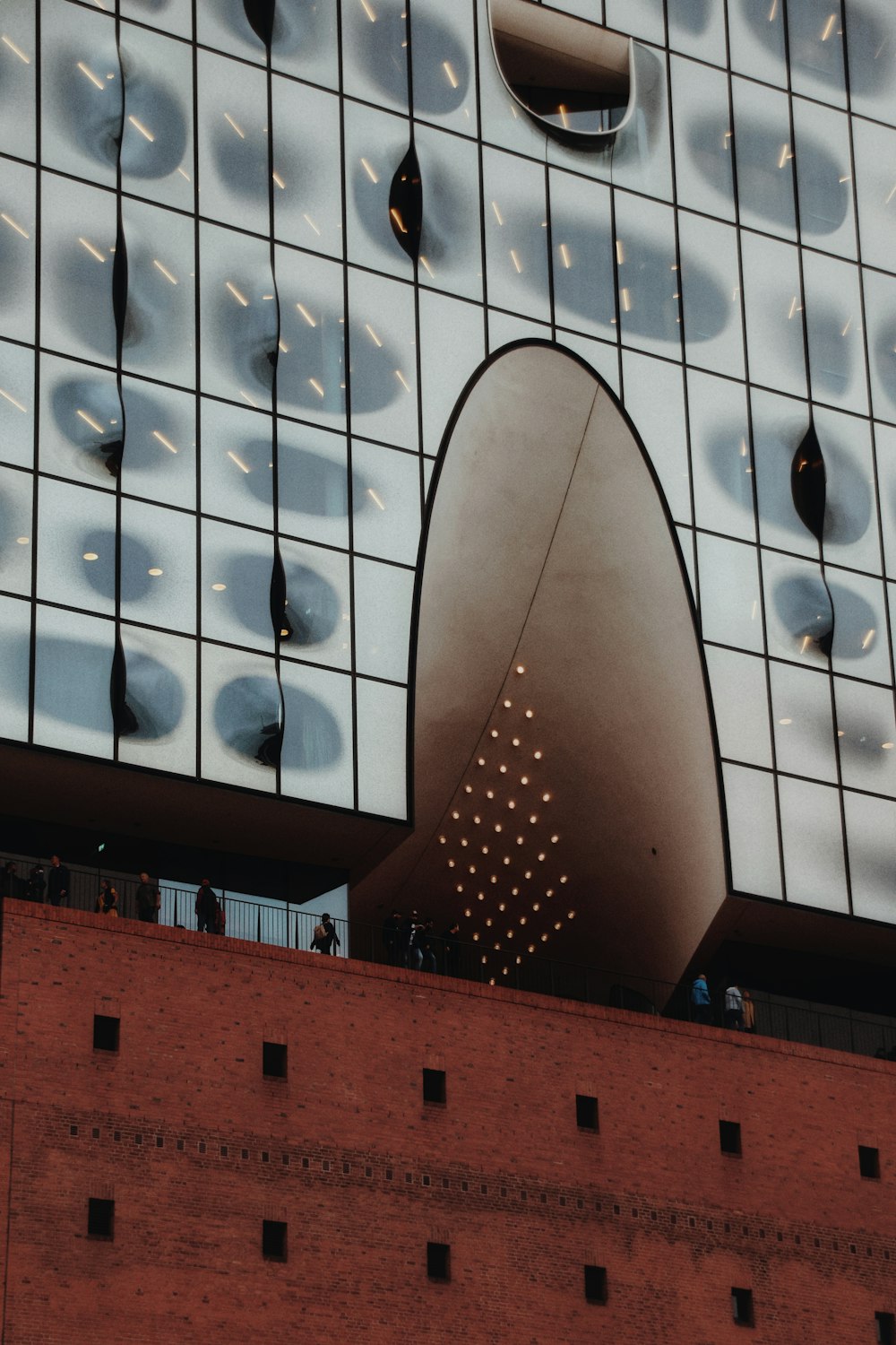 a tall building with a large mirror on it's side