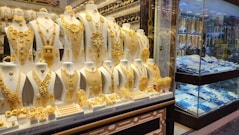 a display case filled with lots of gold jewelry