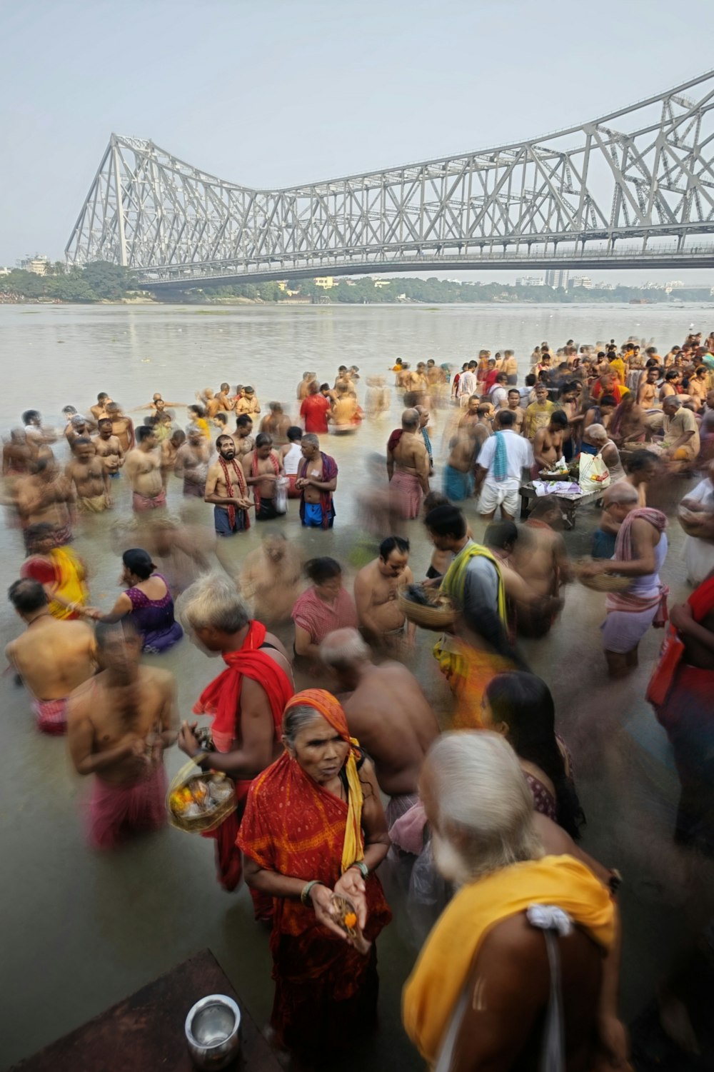 a large group of people in a body of water