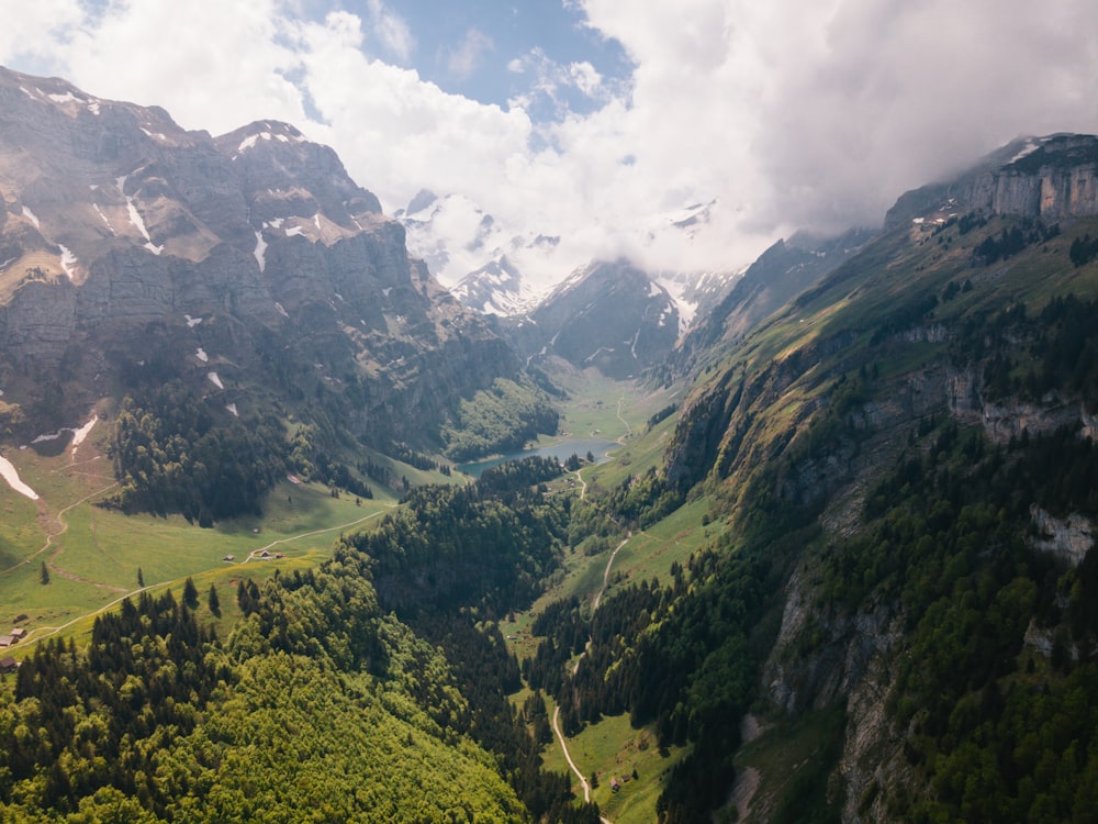 a view of a valley with mountains in the background