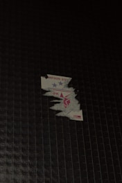 Close-up of a custom vinyl sticker being peeled off its backing