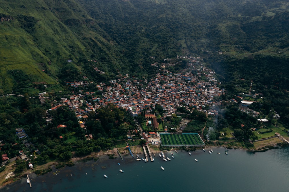 an aerial view of a small town on a lake