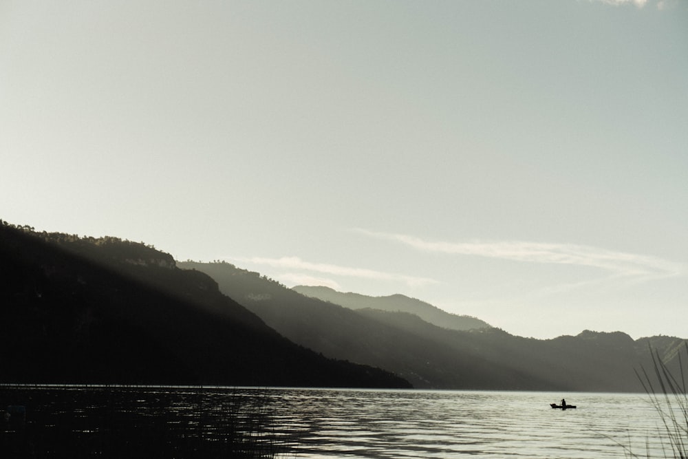 a person in a boat on a large body of water