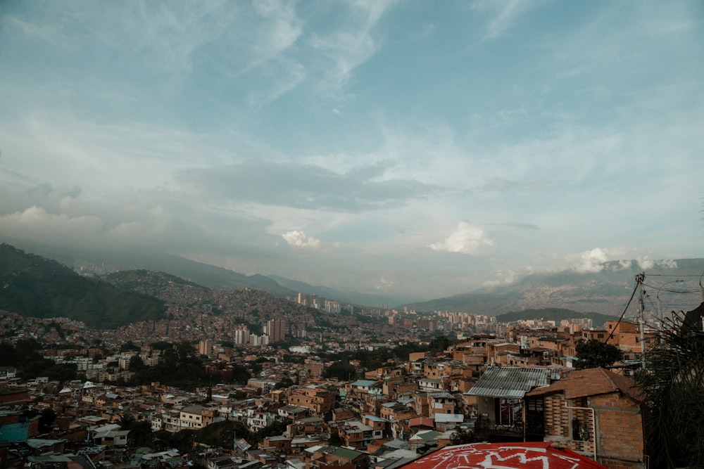 a view of a city with mountains in the background