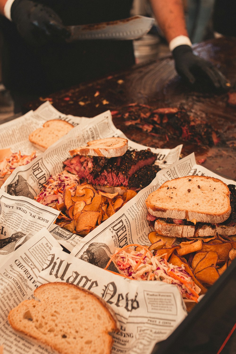 a tray of sandwiches and chips on a table