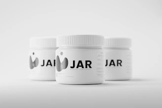 Custom-labeled supplement jars demonstrating Pureform Pack’s OEM logo printing capabilities.