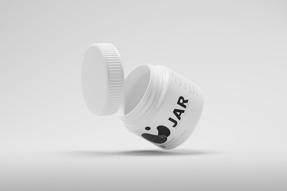 a white jar with a black and white logo on it