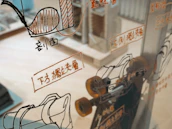 A team of engineers collaborating over mirror designs, highlighting production expertise.