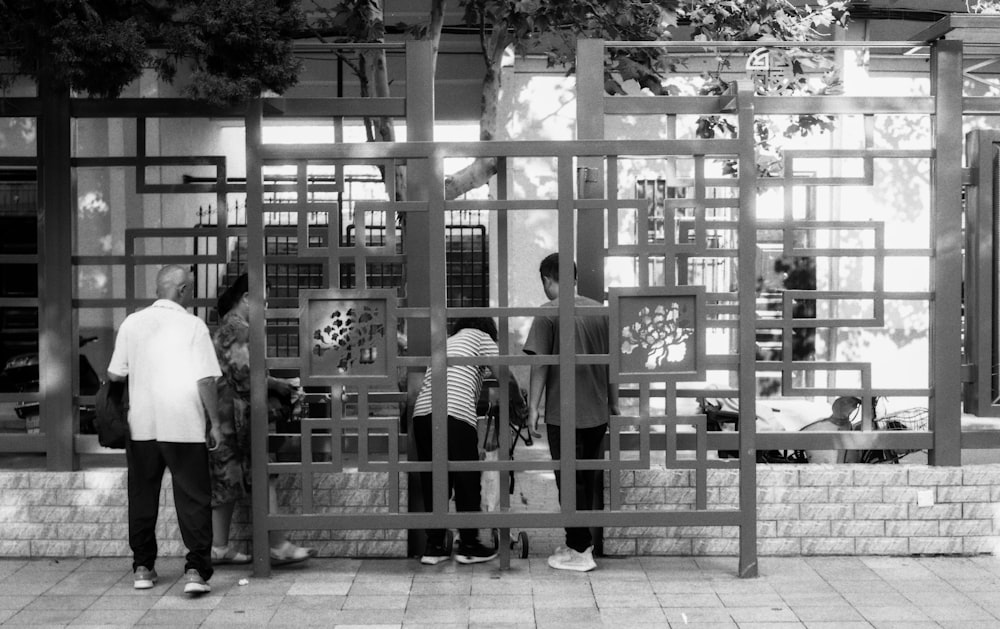 a group of people standing outside of a building