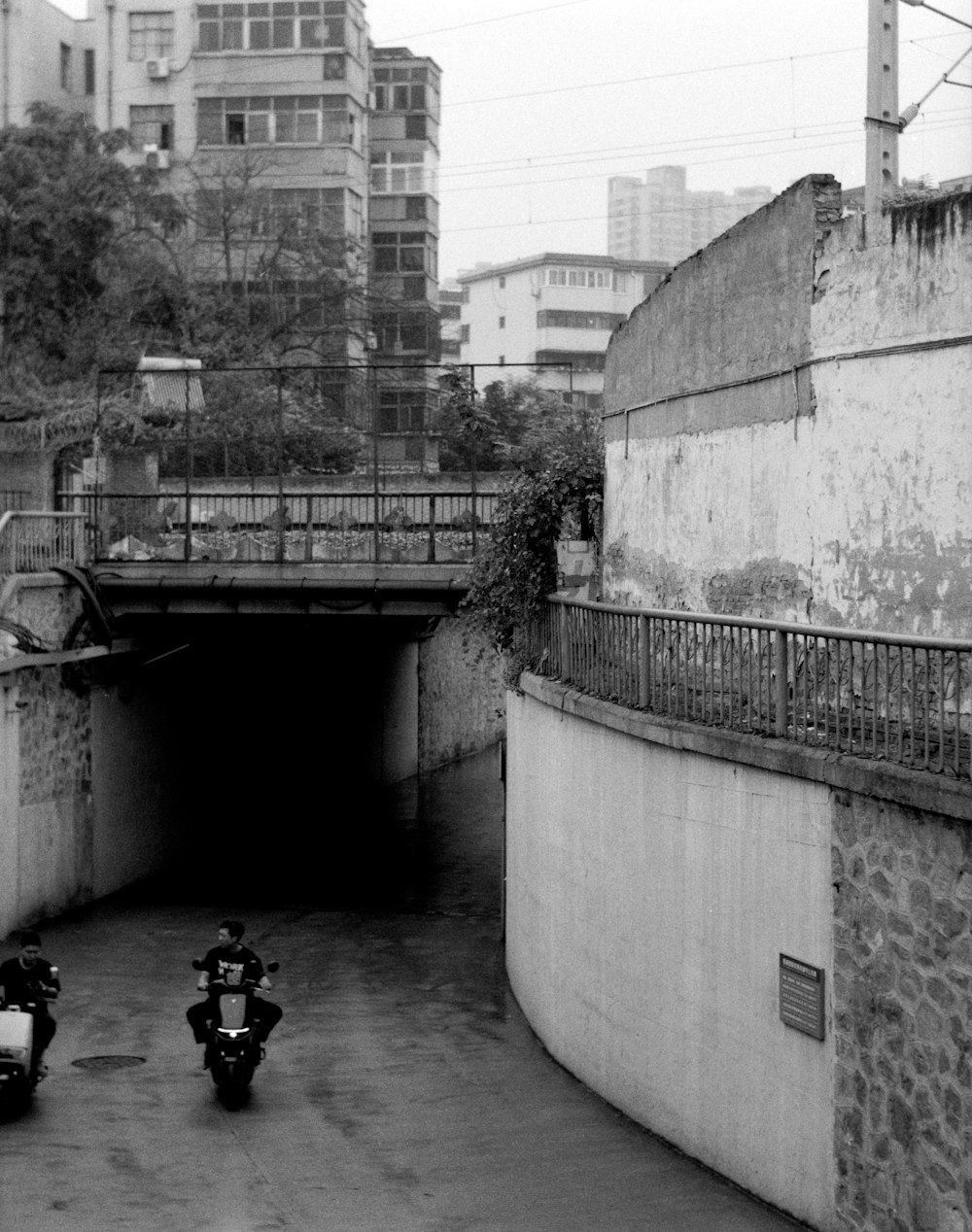 a couple of motorcycles parked in a tunnel