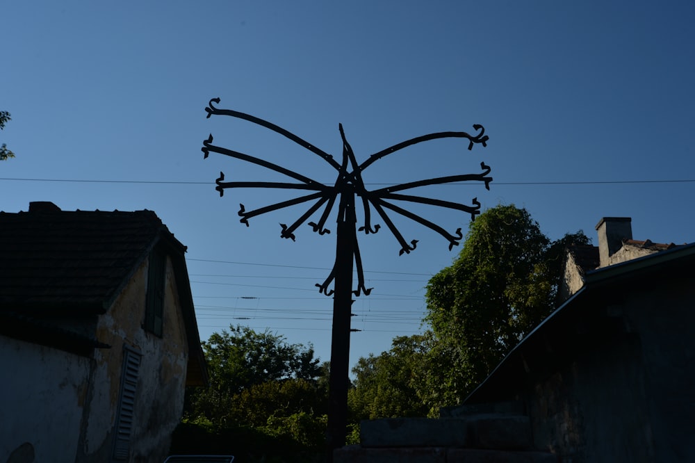 a weather vane on the side of a building