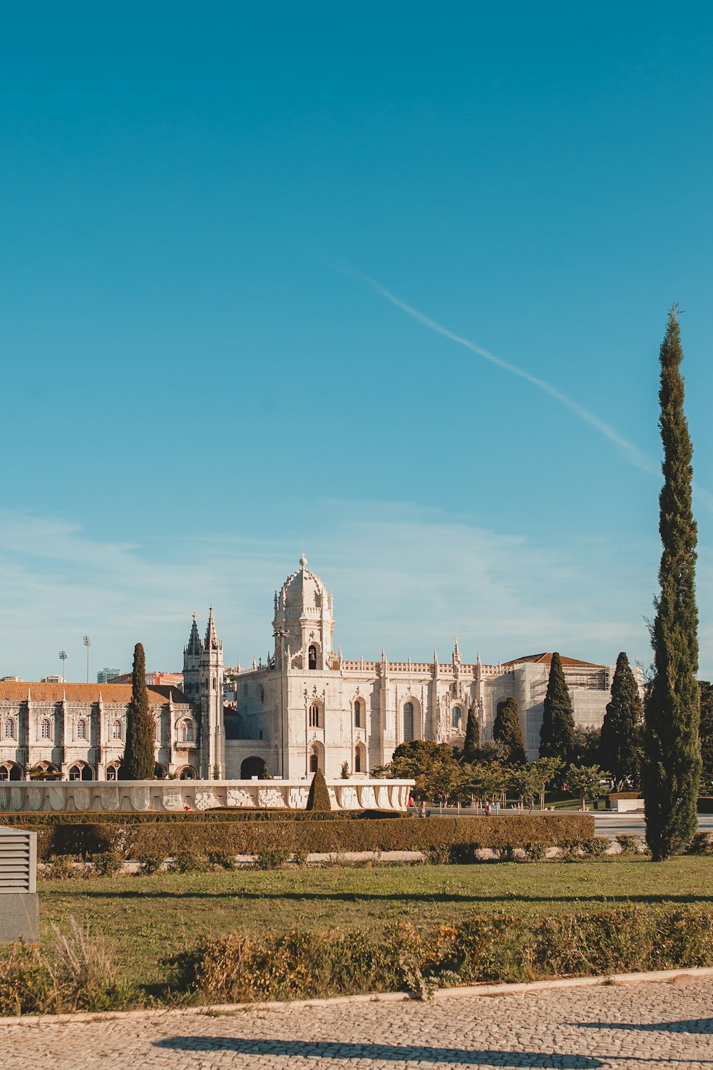 a large white building with a clock tower