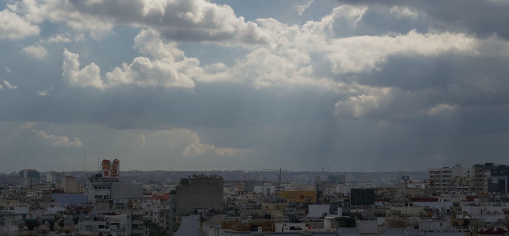 a view of a city with clouds in the sky