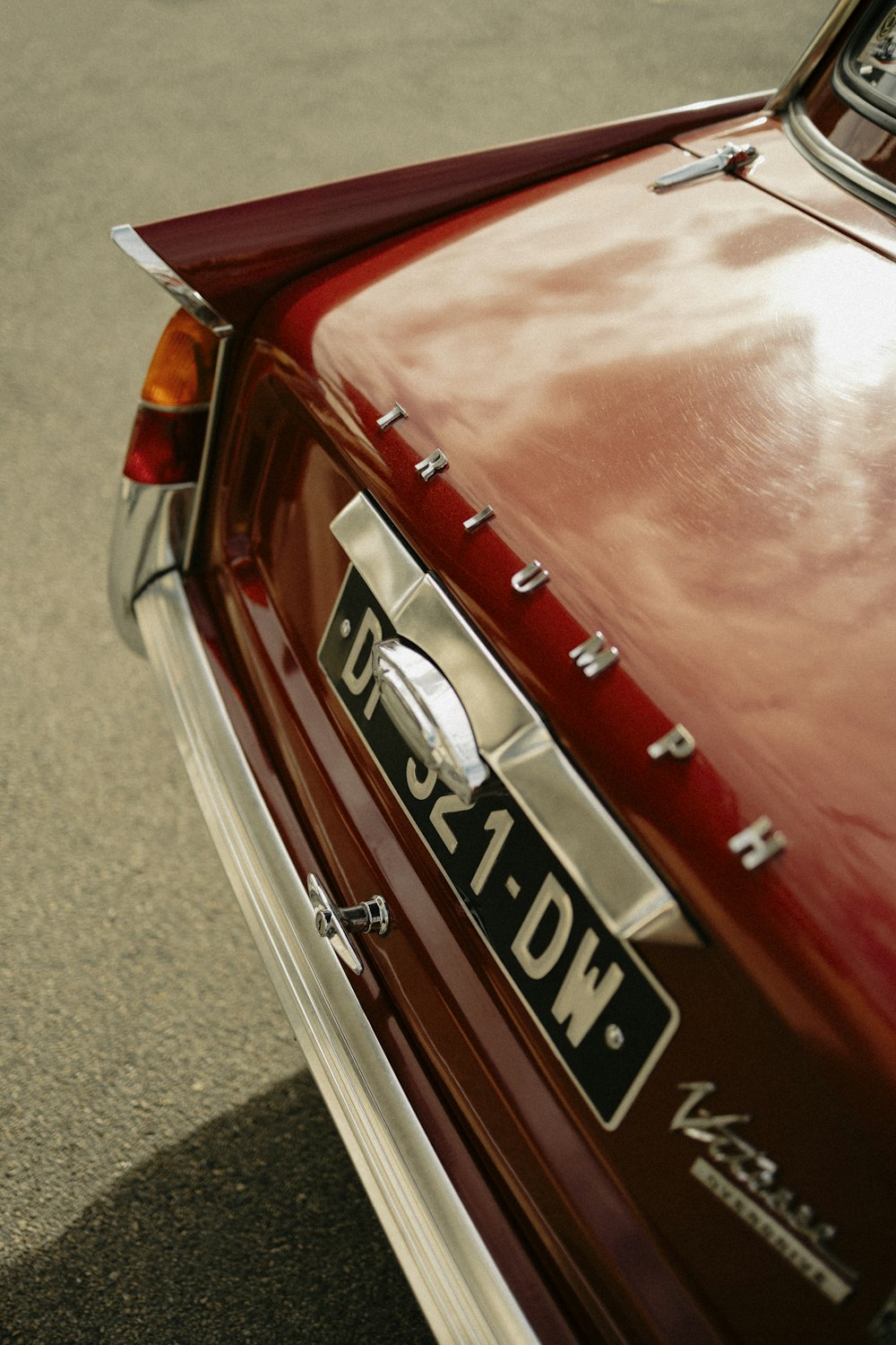 a red car parked on the side of the road