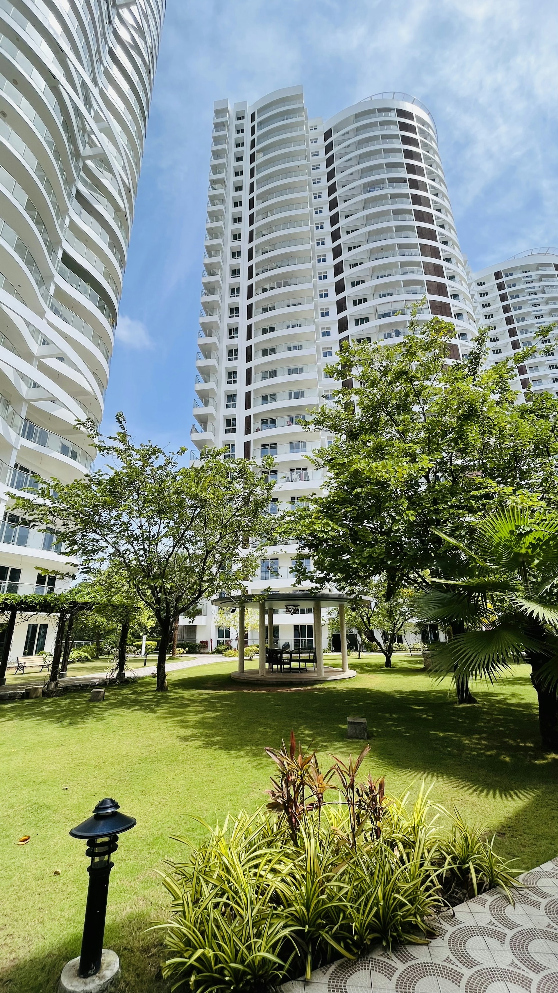 woman wearing yellow long-sleeved dress under white clouds and blue sky during daytime