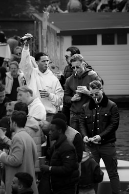 A group of men sharing a moment of camaraderie outdoors in Hong Kong.