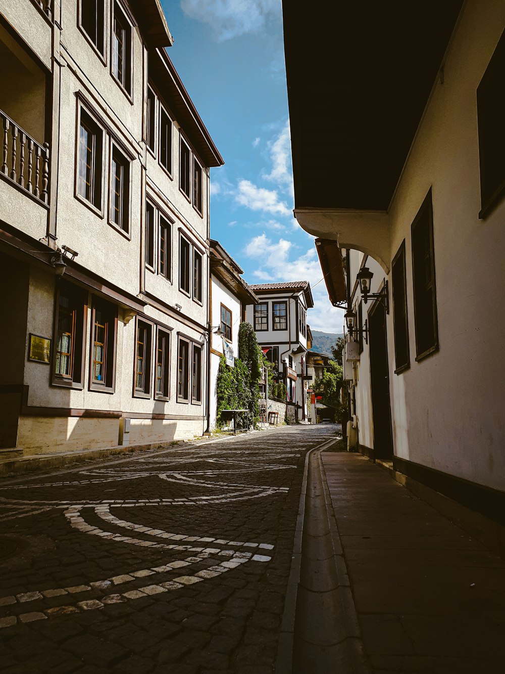 an empty street with buildings on both sides