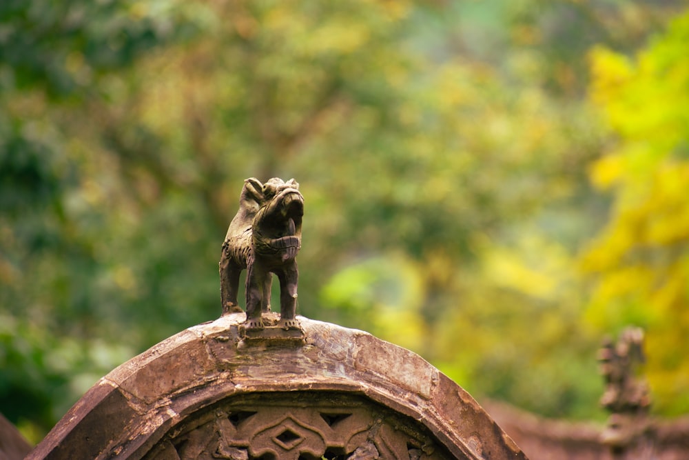 a statue of a dog on top of a building