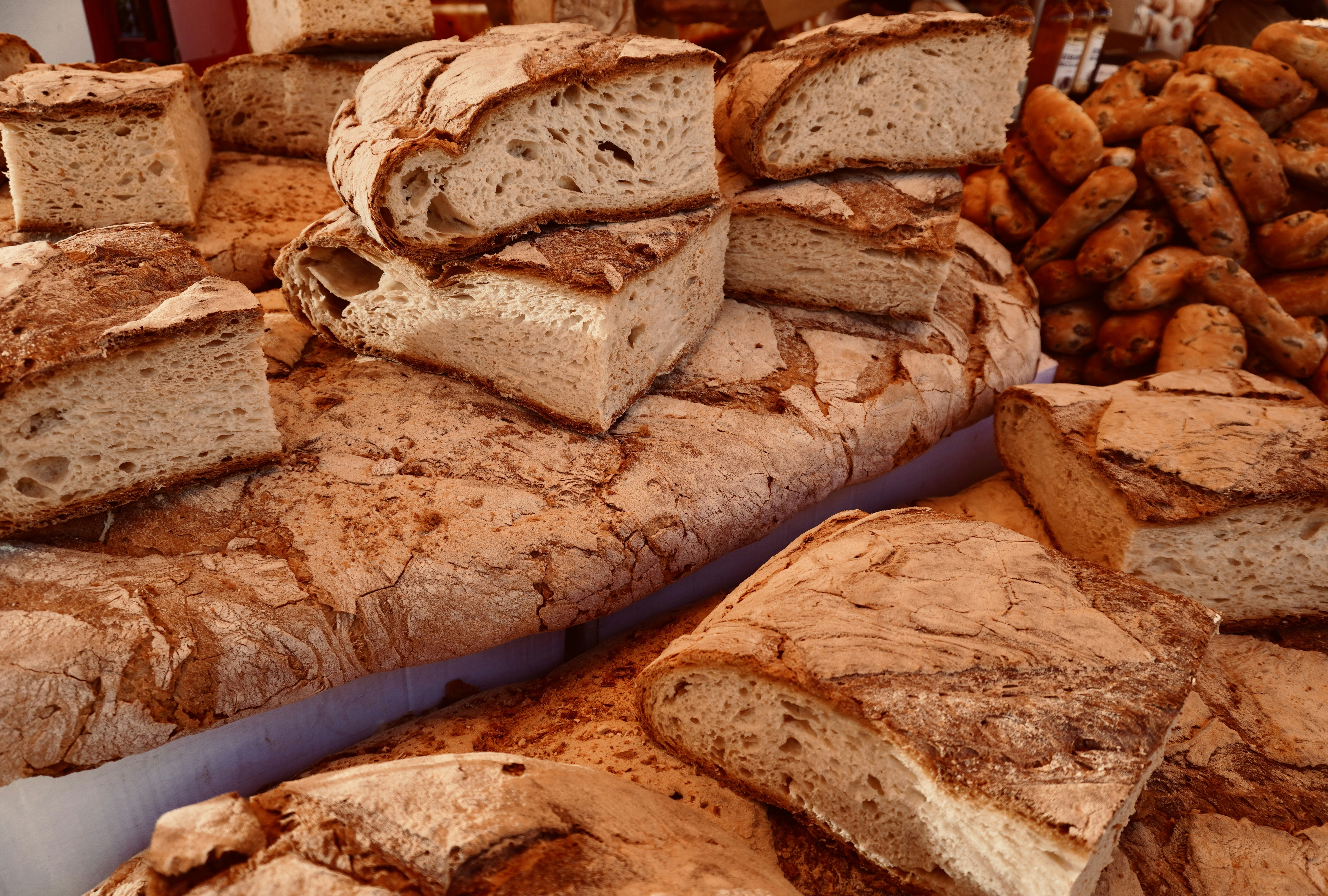 a pile of bread sitting on top of a table