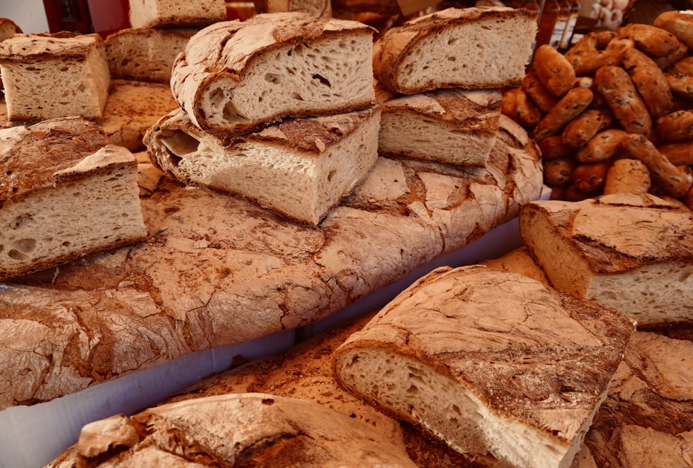 a pile of bread sitting on top of a table