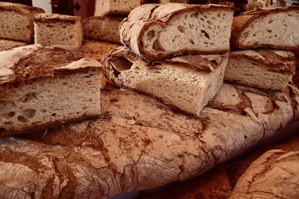 a bunch of breads that are stacked on top of each other