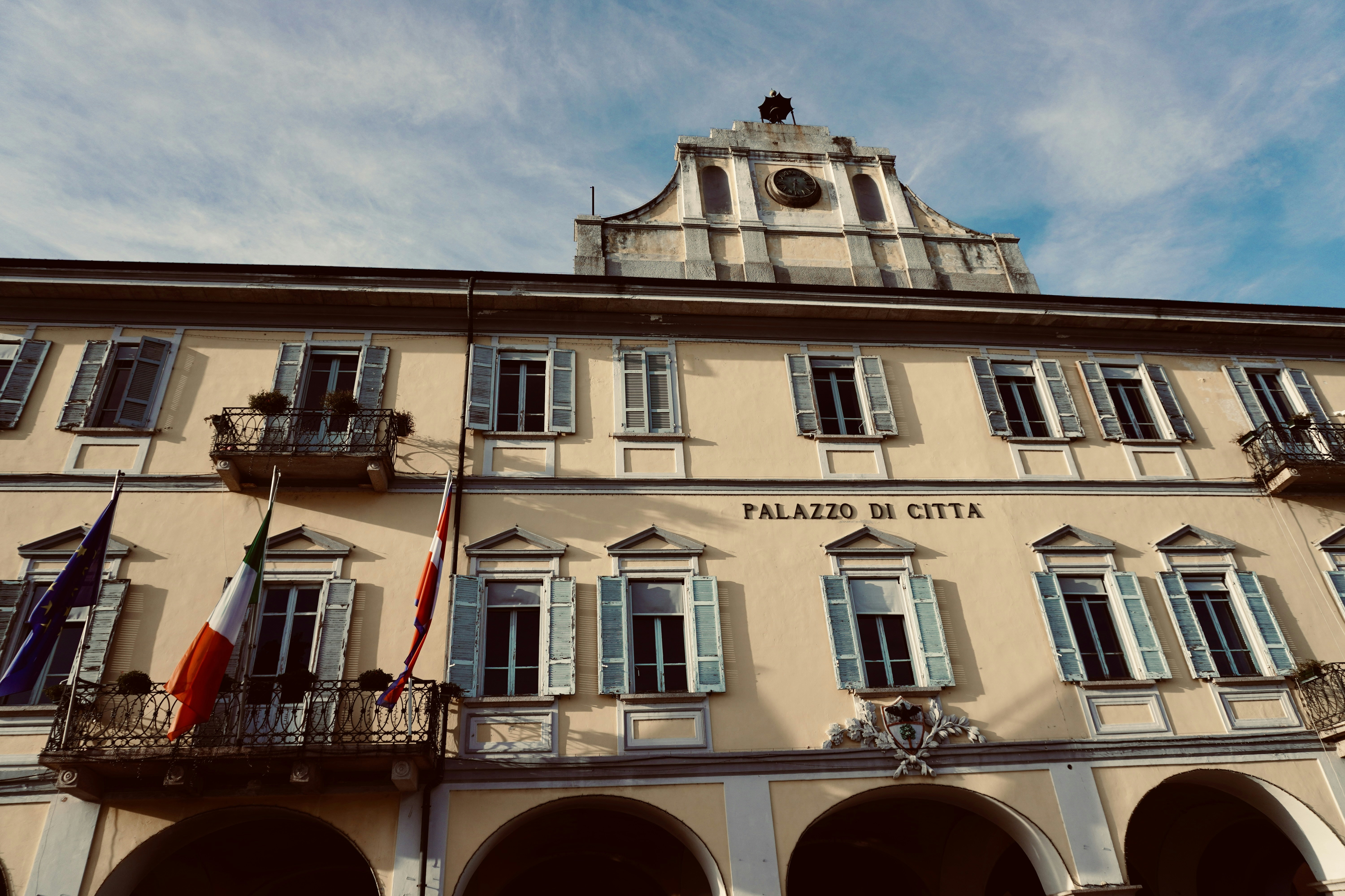 a tall building with a clock tower on top of it, Pallanza (Italy) - Palazzo di Citta photo by rouichi / switzerland