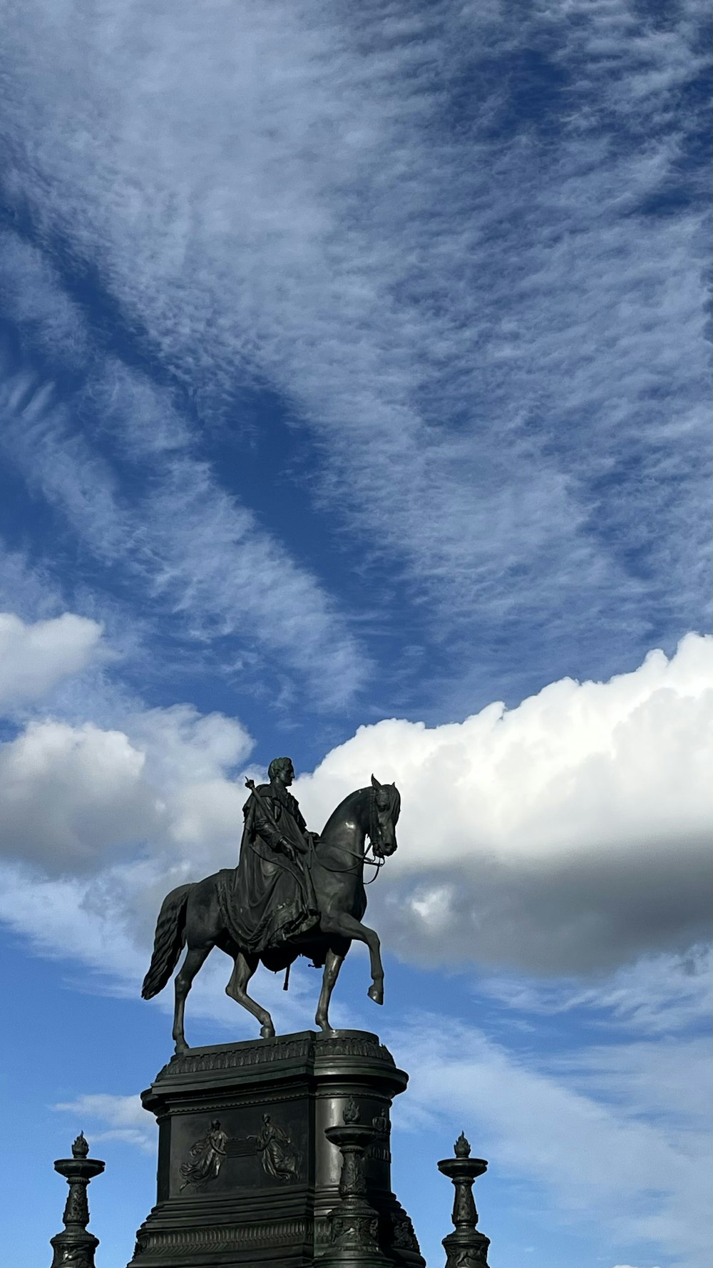 a statue of a man riding a horse