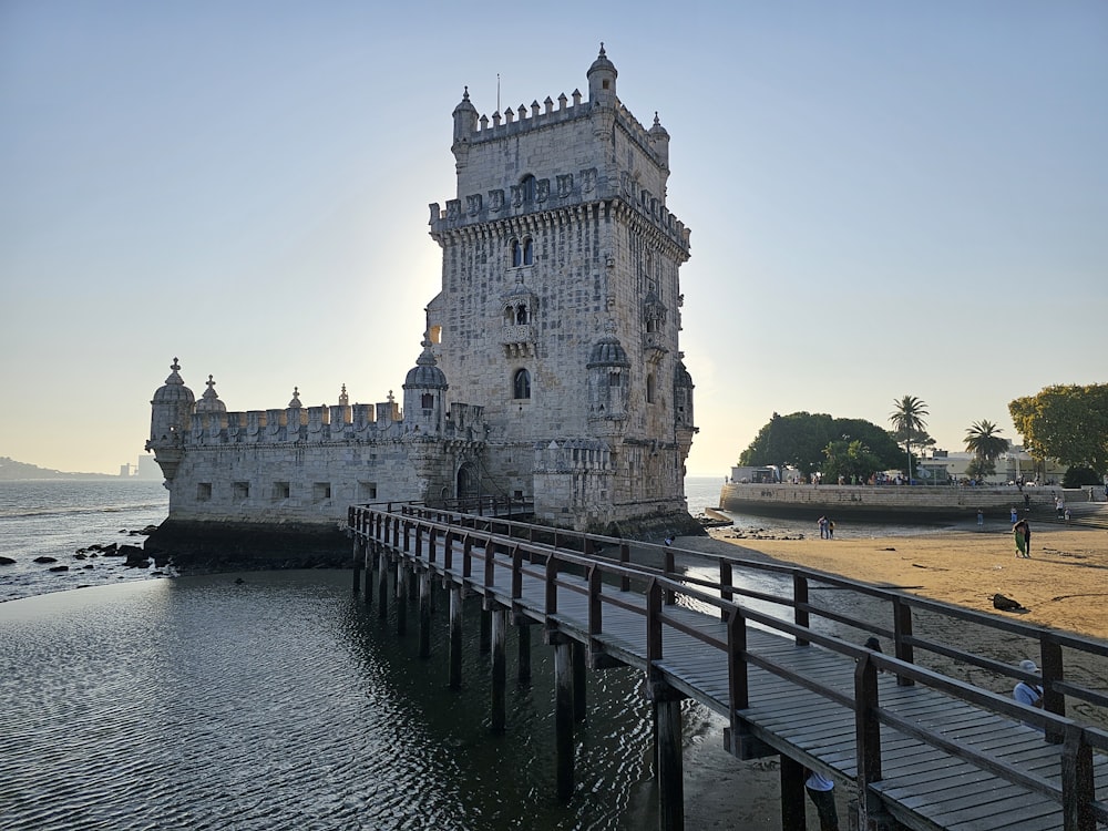 a very tall tower sitting on top of a body of water