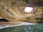 a view of the inside of a cave from the water